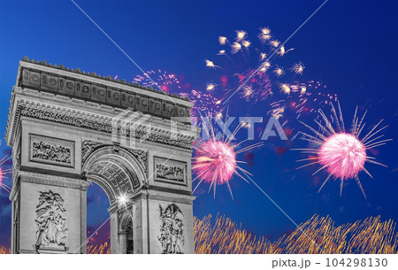Celebratory colorful fireworks over the Arc de Triomphe, Paris, France 104298130