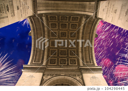 Celebratory colorful fireworks over the Arc de Triomphe, Paris, France 104298445