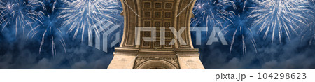 Celebratory colorful fireworks over the Arc de Triomphe, Paris, France 104298623