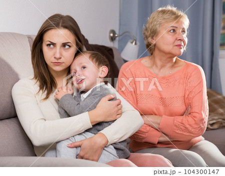 Two women are quarreling for upbringing toddler 104300147