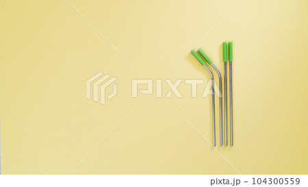 Eco-friendly, reusable metal drinking straws, space for text 104300559