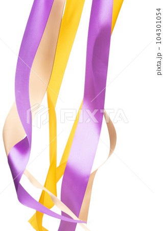 Yellow Gold Purple ribbon long straight fly in air with curve roll shiny. Yellow Golden Purple ribbon for present gift birthday party to wrap around decorate and make of textile cloth long straight. 104301054