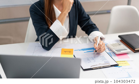 Concept of modern girl leadership, Businesswoman reading data on document and thinking new startup Concept of modern girl leadership, Businesswoman reading data on document and thinking new startup 104303472
