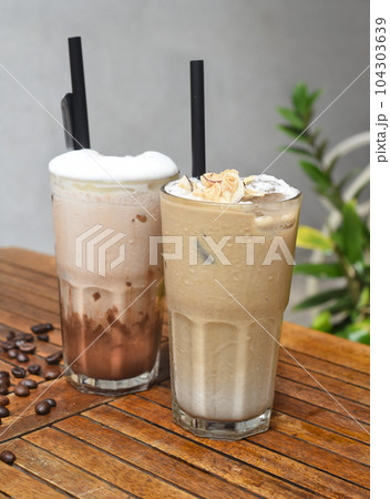 Coffee beverages on wooden table with coffee beans 104303639
