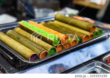 Colorful sticky rice in bamboo in vietnamese night market Colorful sticky rice in bamboo in vietnamese night market 104305280