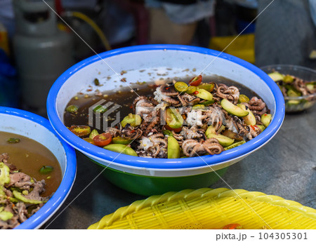 Seafood as squid with vegetables in vietnamese night market 104305301