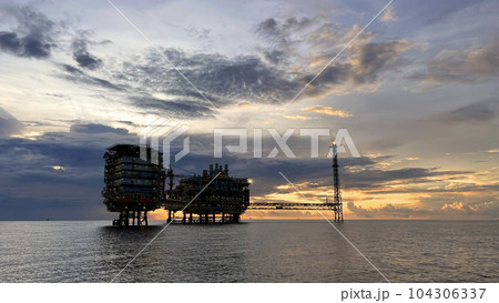 Offshore construction platform for production oil and gas. Oil and gas industry and hard work. Production platform and operation process by manual and auto function from control room. Offshore construction platform for production oil and gas. Oil and gas industry and hard work. Production platform and operation process by manual and auto function from control room. 104306337