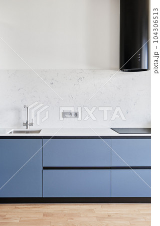 A modern kitchen with gleaming household equipment 104306513