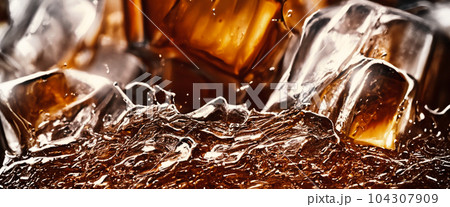 Cola with Ice. Close up of the ice cubes in cola water. Texture of carbonate drink with bubbles in glass. Cola soda and ice splashing fizzing or floating up to top of surface. Cold drink background. 104307909