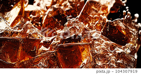 Cola with Ice. Close up of the ice cubes in cola water. Texture of carbonate drink with bubbles in glass. Cola soda and ice splashing fizzing or floating up to top of surface. Cold drink background. 104307919