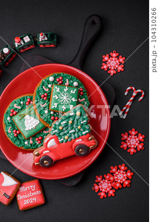 Beautiful bright colorful homemade gingerbread cookies on a ceramic plate 104310266