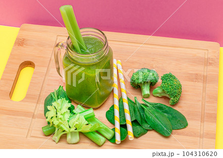 Fresh Green Smoothie of Apple, Celery, and Spinach in Glass Smoothie Jar Fresh Green Smoothie of Apple, Celery, and Spinach in Glass Smoothie Jar 104310620