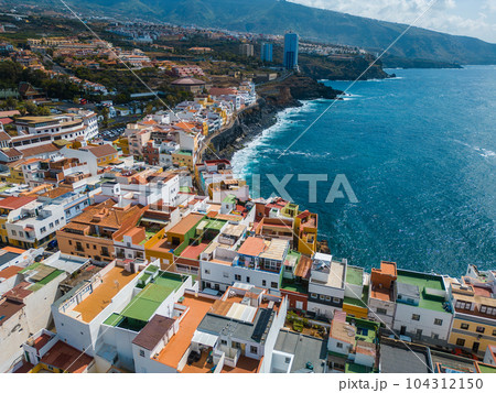 blue water ocean shore, small cozy village Punta Brava, Tenerife, Canary aerial 104312150