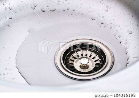 Stainless steel sink with splash of water. Stainless steel sink with splash of water. 104316195