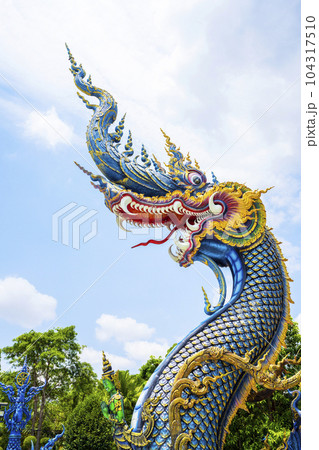 The Naga head at Rong Sua Ten temple or Blue temple in Chiang Rai Province, Thailand The Naga head at Rong Sua Ten temple or Blue temple in Chiang Rai Province, Thailand 104317510