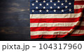 Folded vintage USA flag on wood plank background 104317960