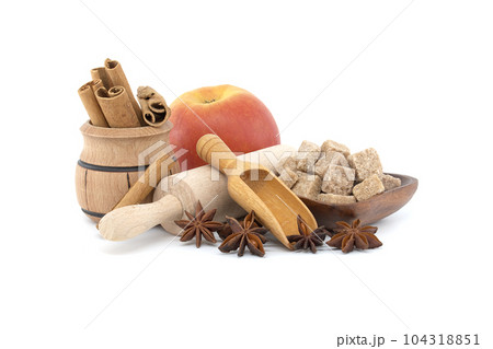 Group of wooden utensils and spices isolated on white Group of wooden utensils and spices isolated on white 104318851