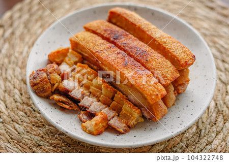 crispy fried pork belly in a plate 104322748