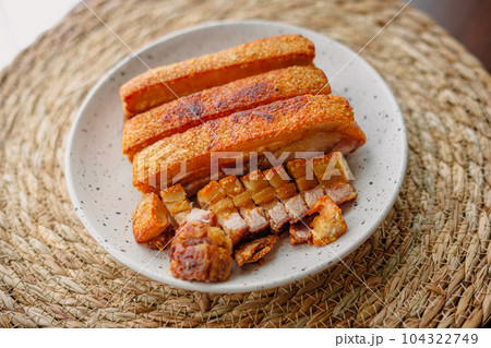 crispy fried pork belly in a plate 104322749