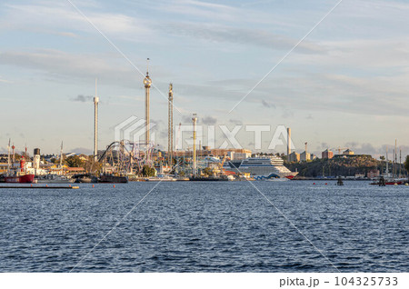 View of amusement park Grona Lund with carousels and tour rides on Djurgarden island Stockholm Sweden 104325733