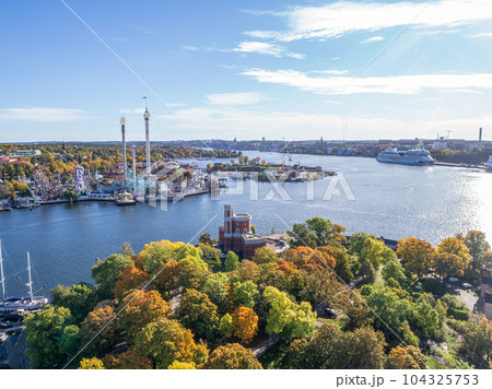 View of amusement park Grona Lund with carousels and tour rides on Djurgarden island Stockholm Sweden 104325753