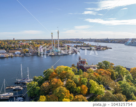 View of amusement park Grona Lund with carousels and tour rides on Djurgarden island Stockholm Sweden View of amusement park Grona Lund with carousels and tour rides on Djurgarden island Stockholm Sweden 104325754