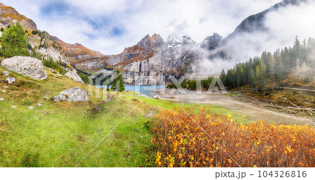 Spectacular autumn view of Oeschinensee Lake. Spectacular autumn view of Oeschinensee Lake. 104326816