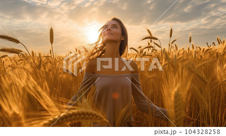 Silhouette of women in grass field at sky sunset Silhouette of women in grass field at sky sunset 104328258