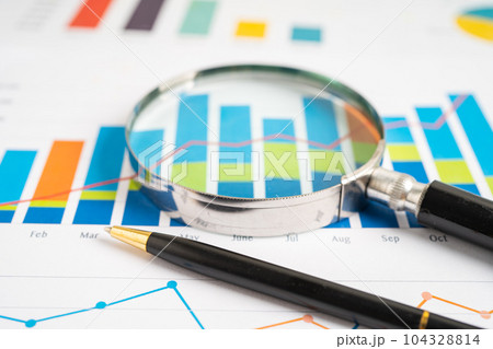 Magnifying glass on graph paper. Financial development, Banking Account, Statistics, Investment Analytic research data economy, Business concept. 104328814