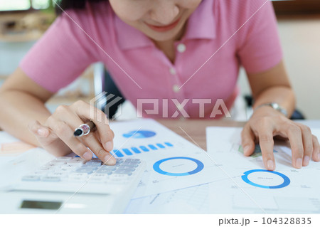 Accountants, Asian auditors are using calculators and computers to review annual tax budgets to submit information to the IRS 104328835