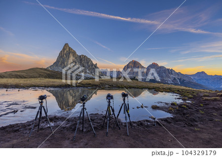 Camera on a tripod in the landscape, Giau Pass (Passo Giau), Dolomites Alps, South Tyrol, Italy 104329179