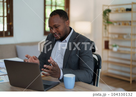african american man, video call and laptop, wave hello and meeting, consulting or internet planning in startup company. Happy worker greeting for online meeting, computer webinar. 104330132