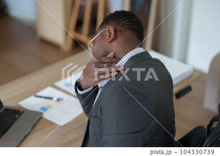 Burnout American African business man in stress works with many paperwork document, migraine attack, Freelance, work from home. Burnout American African business man in stress works with many paperwork document, migraine attack, Freelance, work from home. 104330739