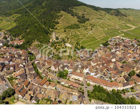 Aerial Drone Shot of the village of Kaysersberg in Alsace in a day. Summer in France, Castle and a beautiful City Aerial Drone Shot of the village of Kaysersberg in Alsace in a day. Summer in France, Castle and a beautiful City 104331921