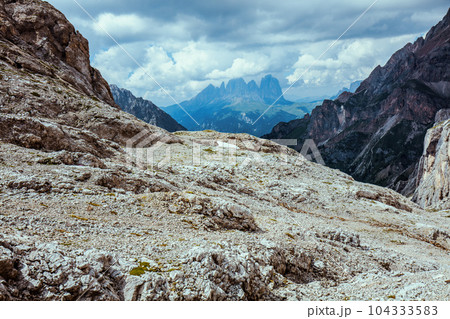 landscape with mountains, clouds and rocks landscape with mountains, clouds and rocks 104333583