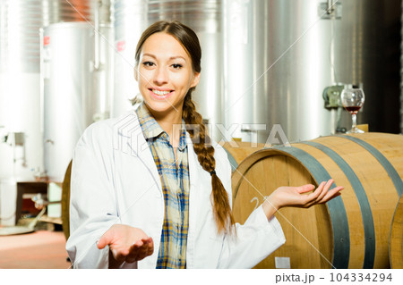 professional checks the wine at factory in France professional checks the wine at factory in France 104334294