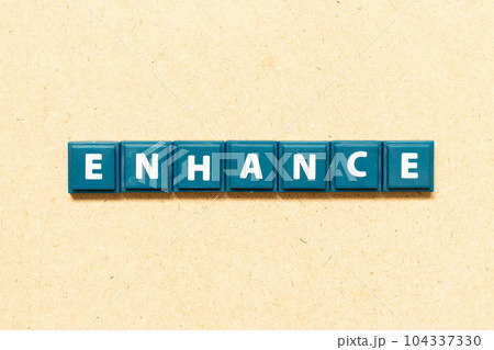 Tile alphabet letter in word enhance on wood background 104337330