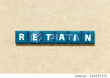 Tile alphabet letter in word retain on wood background Tile alphabet letter in word retain on wood background 104337372