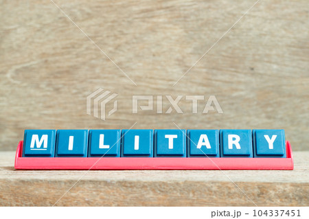 Tile alphabet letter with word military in red color rack on wood background 104337451