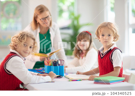 Kids in school. Children in class. Kids in school. Children in class. 104340525