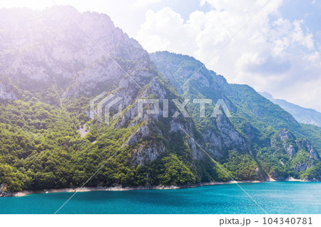 Landscape view of big lake between mountains at summer day 104340781