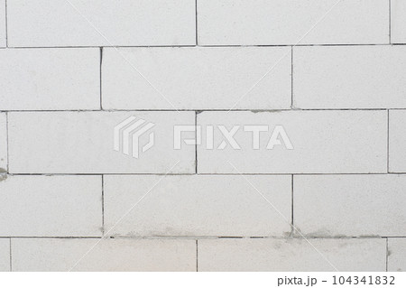Wall and gas block masonry thinly with joint glue. 104341832