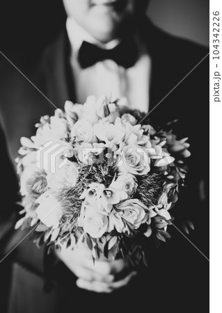 Beautiful wedding bouquet with different flowers, roses 104342226