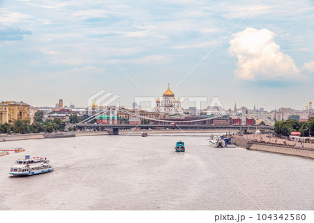 Cruise ship sails on the Moscow river in Moscow city center, popular place for walking. 104342580