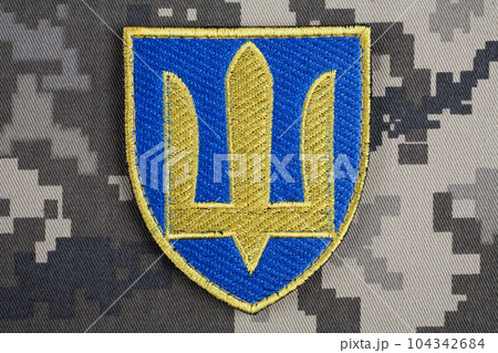 KYIV, UKRAINE - October 5, 2022. Russian invasion in Ukraine 2022. Ukraine Army Commander in Chief of the Armed Forces of Ukraine uniform shoulder sleeve insignia badge. 104342684
