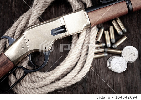 Old west guns. Lever action repeating rifles with ammunition Old west guns. Lever action repeating rifles with ammunition 104342694