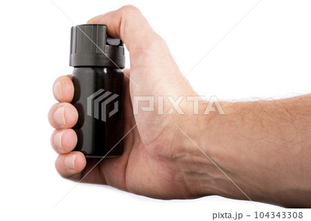 Hand with bottle of pepper spray in eyes, isolated on white background 104343308