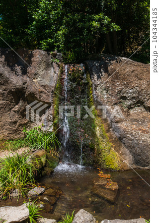 A small waterfall in the garden. A small waterfall in the garden. 104344185