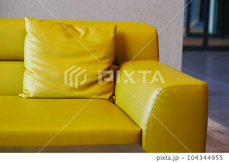modern yellow sofa with pillows in living room at home modern yellow sofa with pillows in living room at home 104344955