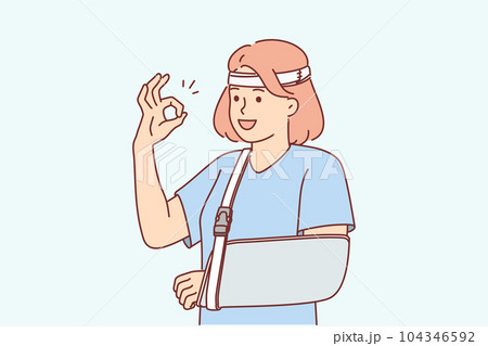 Woman with soft splint on injured arm shows OK gesture rejoices at availability of medical insurance 104346592